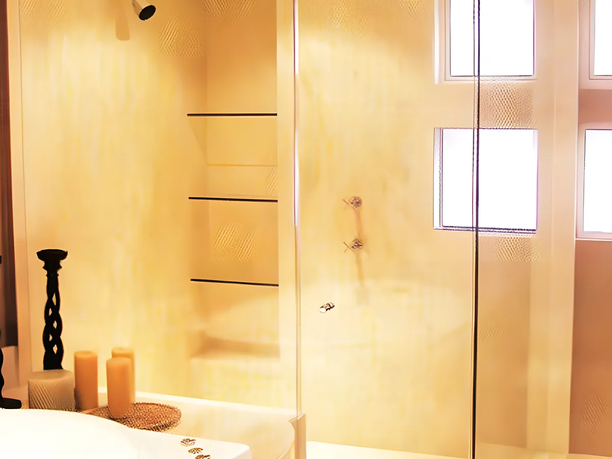 Frameless glass shower enclosure installed by Ely's Glass